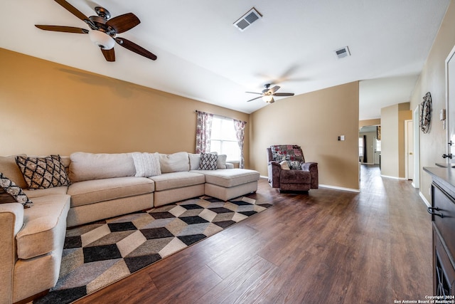 living room with ceiling fan, dark wood-type flooring, and lofted ceiling