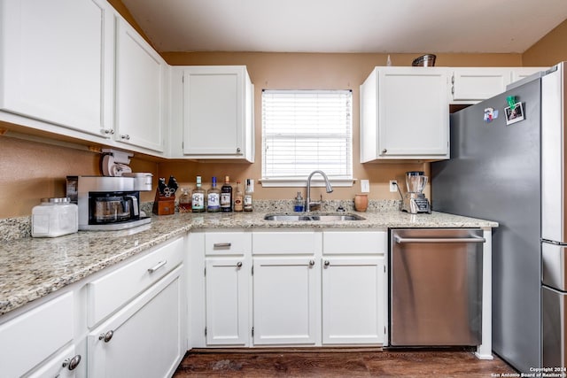 kitchen featuring sink, white cabinets, and stainless steel appliances