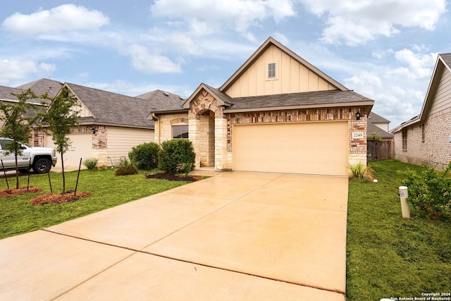 view of front of property with a garage and a front yard