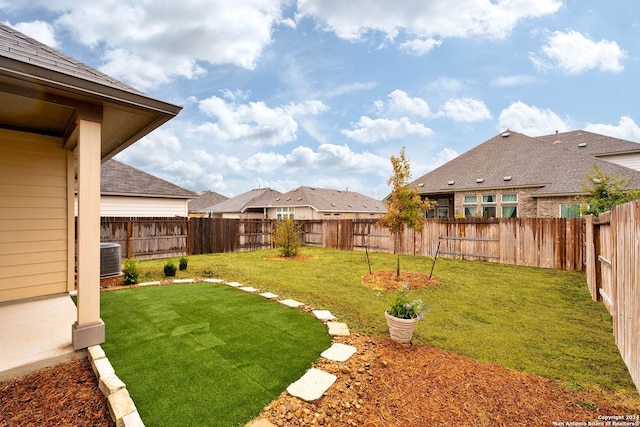 view of yard with central AC unit