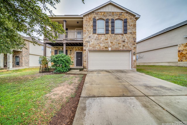 view of front of home featuring a balcony, a front lawn, and a garage