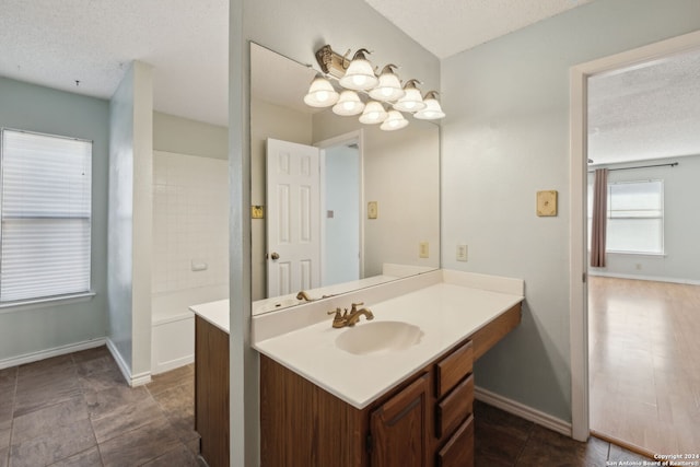 bathroom featuring vanity and a textured ceiling