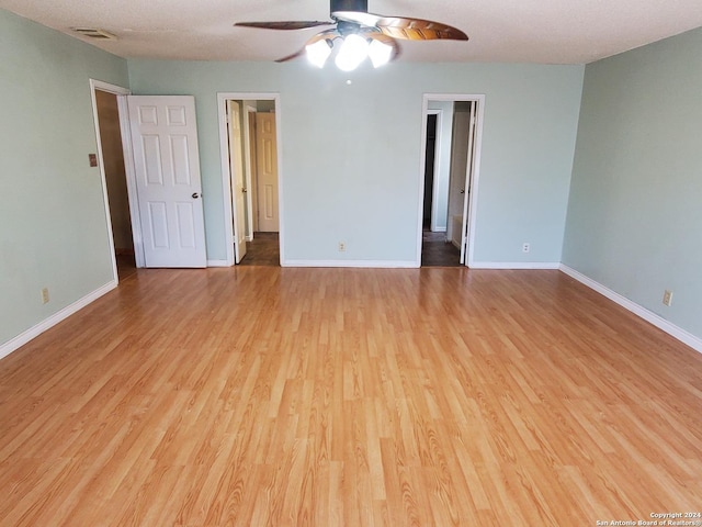 unfurnished room featuring ceiling fan and light wood-type flooring