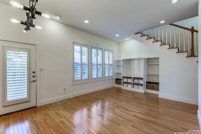 unfurnished living room featuring light wood-type flooring