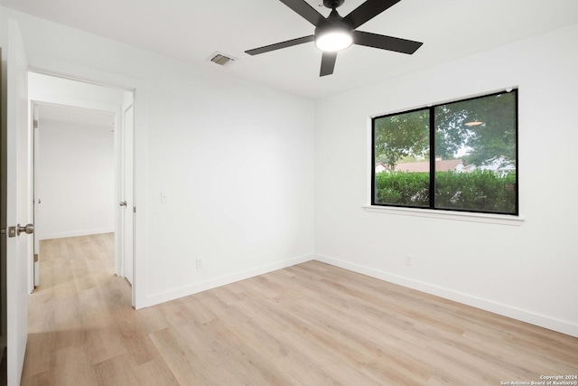 unfurnished room featuring ceiling fan and light hardwood / wood-style flooring