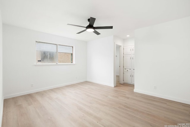 unfurnished room featuring ceiling fan and light wood-type flooring