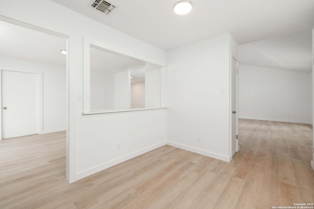 unfurnished room featuring light hardwood / wood-style floors