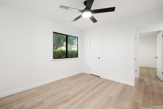 unfurnished bedroom featuring ceiling fan and light wood-type flooring