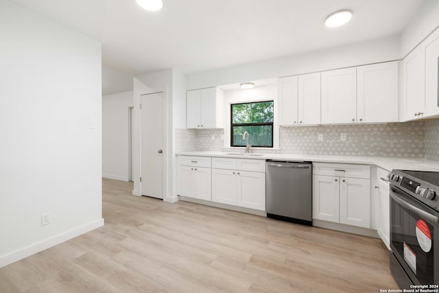 kitchen with sink, white cabinets, and stainless steel appliances