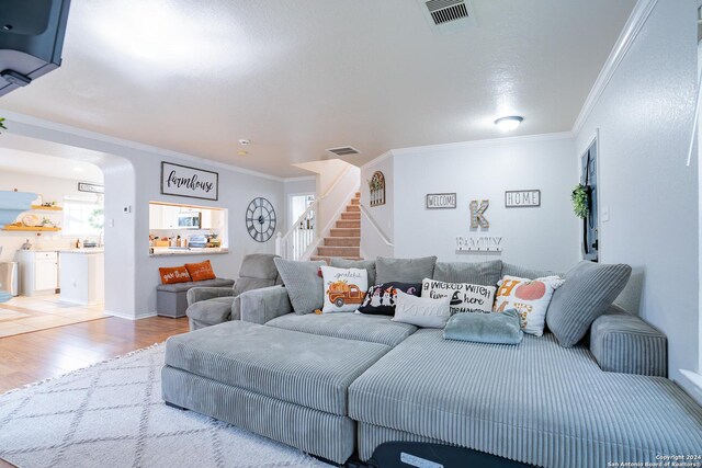 bedroom featuring wood-type flooring and ornamental molding