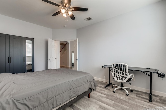 bedroom featuring ceiling fan and light hardwood / wood-style floors