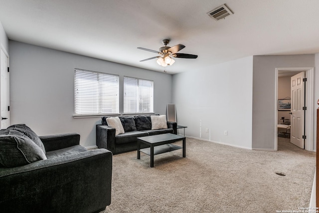 living room featuring ceiling fan and carpet floors