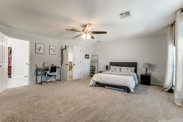 bedroom with light carpet and ceiling fan