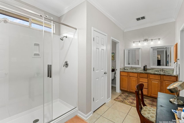 bathroom with crown molding, tile patterned flooring, vanity, and walk in shower