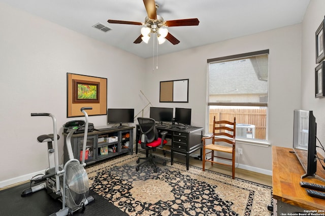 office space with wood-type flooring and ceiling fan