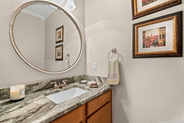 bathroom featuring vanity and crown molding