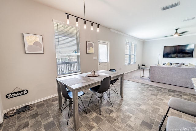 dining room featuring ceiling fan and ornamental molding