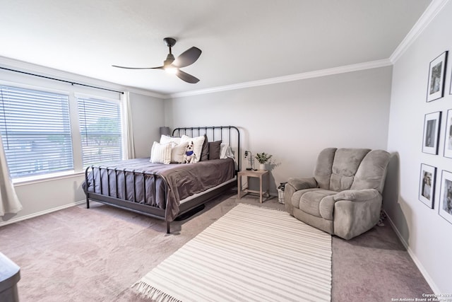 bedroom with carpet flooring, ceiling fan, and ornamental molding