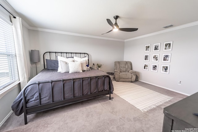 bedroom with carpet flooring, ceiling fan, and ornamental molding