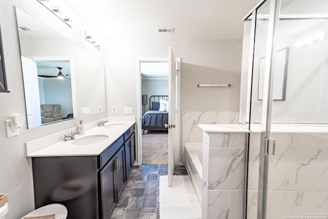 bathroom with vanity, ceiling fan, and an enclosed shower