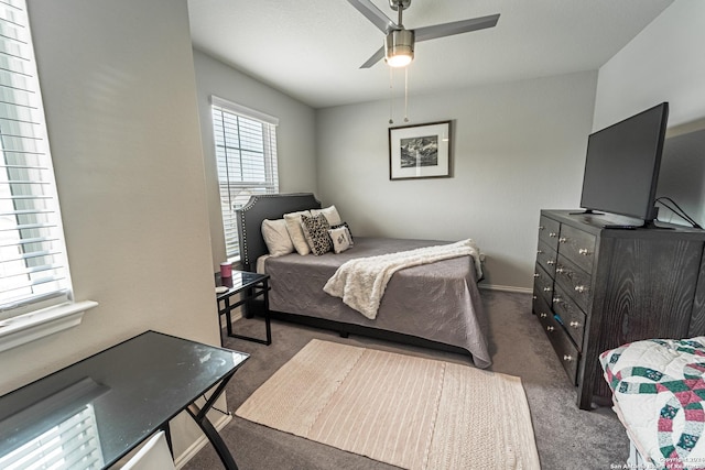 bedroom with dark carpet and ceiling fan