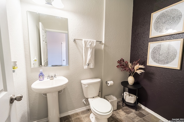 bathroom with sink and toilet