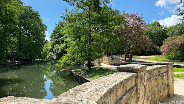 view of community with a water view