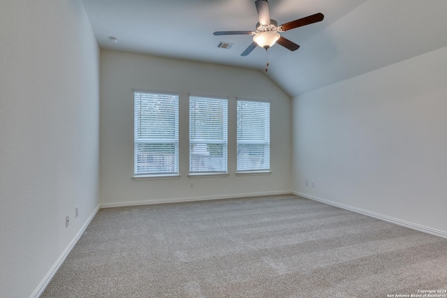 unfurnished room featuring light carpet, ceiling fan, and lofted ceiling