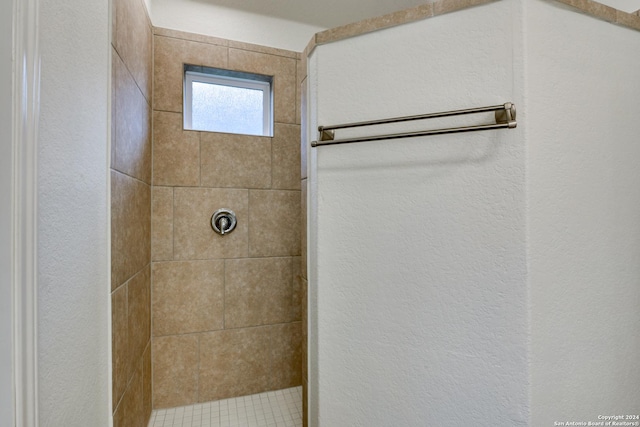 bathroom with tiled shower