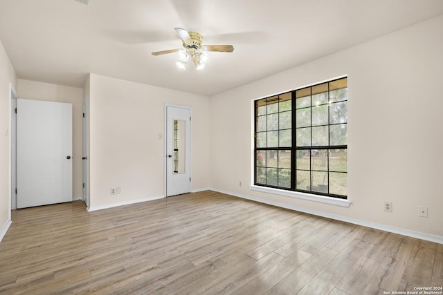 unfurnished room with ceiling fan and light hardwood / wood-style flooring