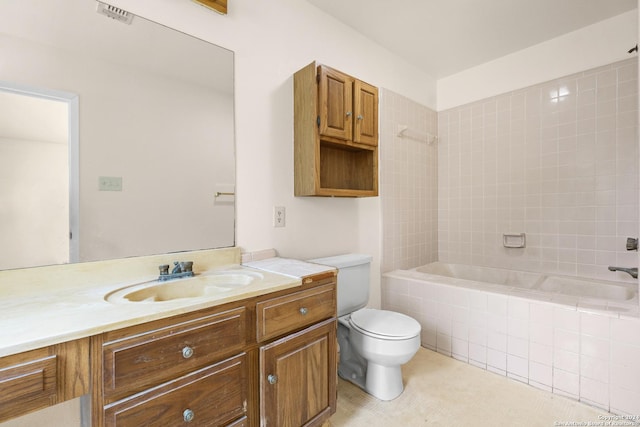 full bathroom with tile patterned floors, vanity, toilet, and tiled shower / bath