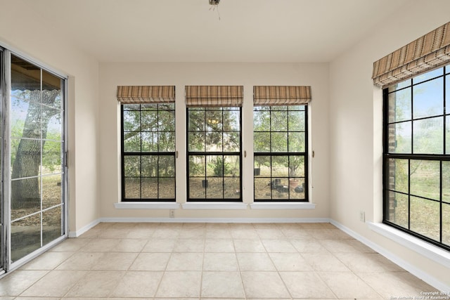 unfurnished sunroom with a healthy amount of sunlight