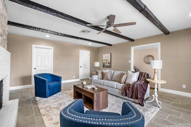 living room with beamed ceiling, ceiling fan, a fireplace, and hardwood / wood-style floors