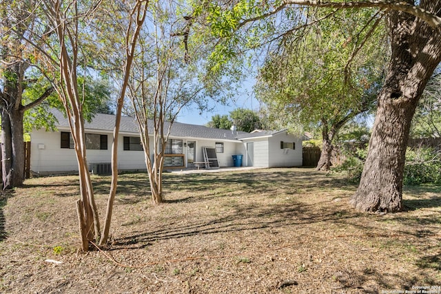 rear view of property featuring central AC unit and a patio