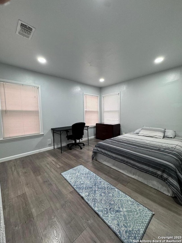 bedroom with hardwood / wood-style flooring