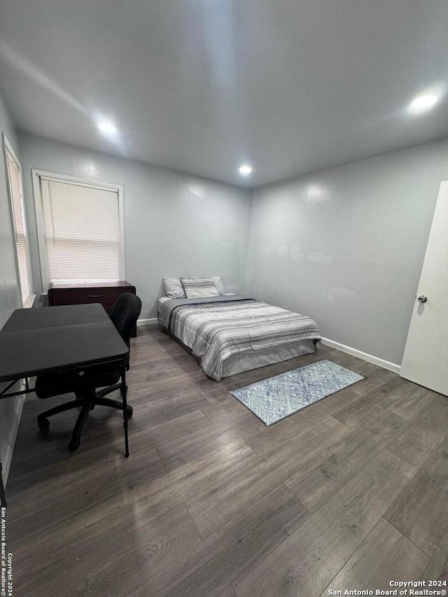 bedroom featuring dark hardwood / wood-style floors