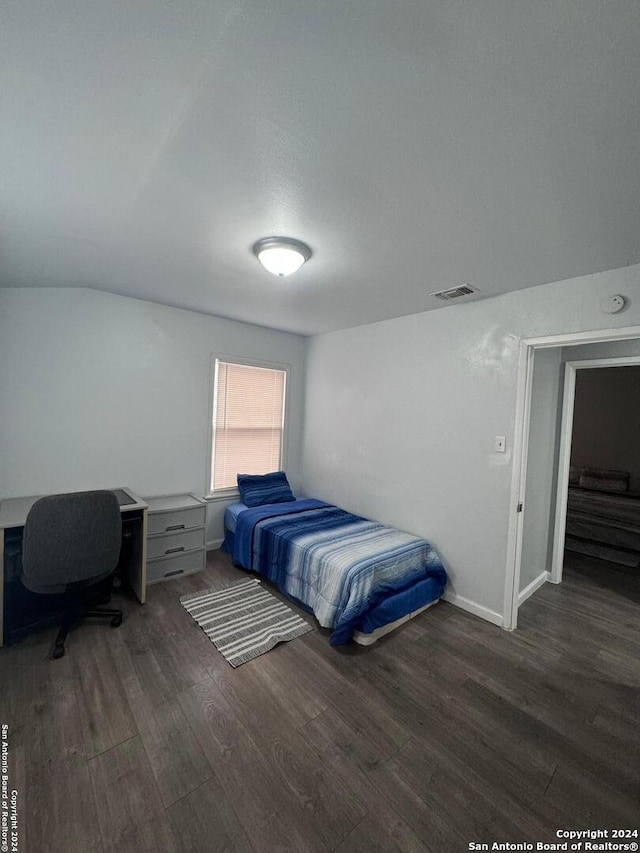 bedroom featuring dark hardwood / wood-style floors