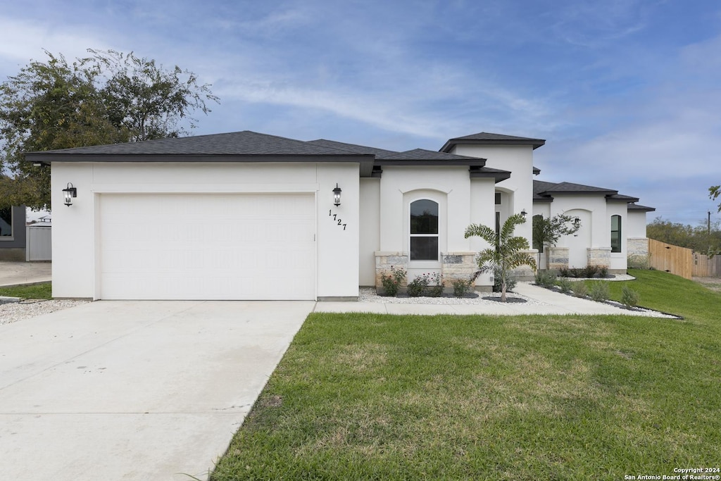1727 Claudia Vis, San Antonio, TX 78224 - view of front of home with a front lawn and a garage