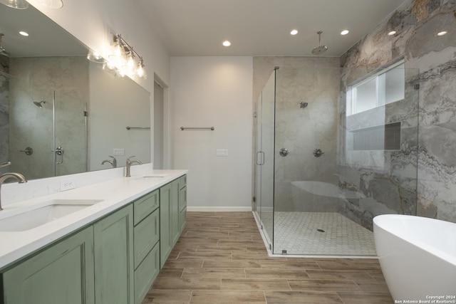 bathroom with vanity and independent shower and bath