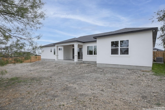 back of house featuring ceiling fan, cooling unit, and a patio