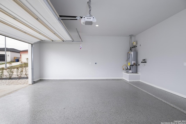 garage featuring a garage door opener and gas water heater