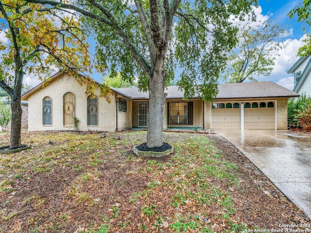 ranch-style home featuring a garage