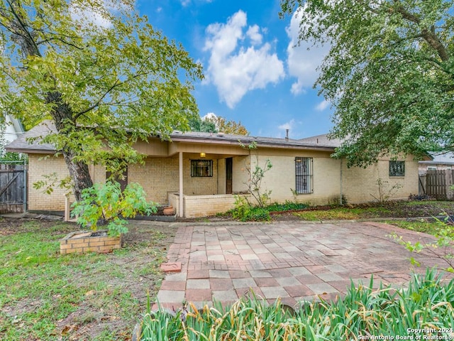 rear view of house with a patio