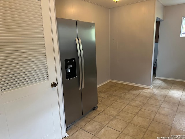 kitchen with stainless steel refrigerator with ice dispenser