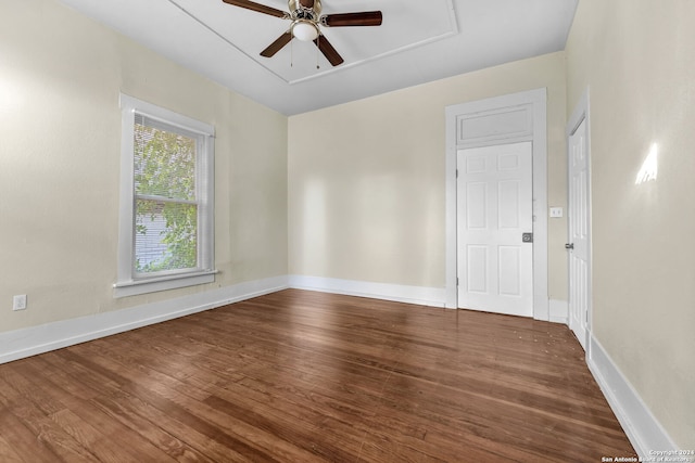 spare room with wood-type flooring and ceiling fan