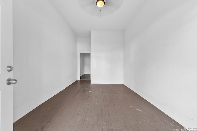 spare room with ceiling fan and dark wood-type flooring