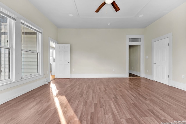 spare room with ceiling fan and light hardwood / wood-style flooring