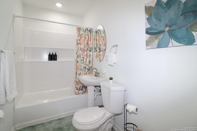 bathroom with toilet and shower / bath combo with shower curtain