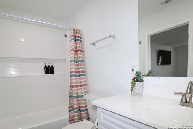 full bathroom with vanity, toilet, and shower / tub combo