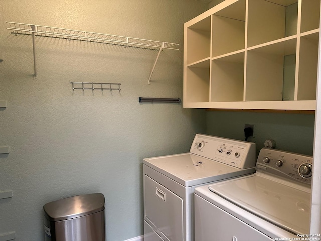 clothes washing area with washer and dryer